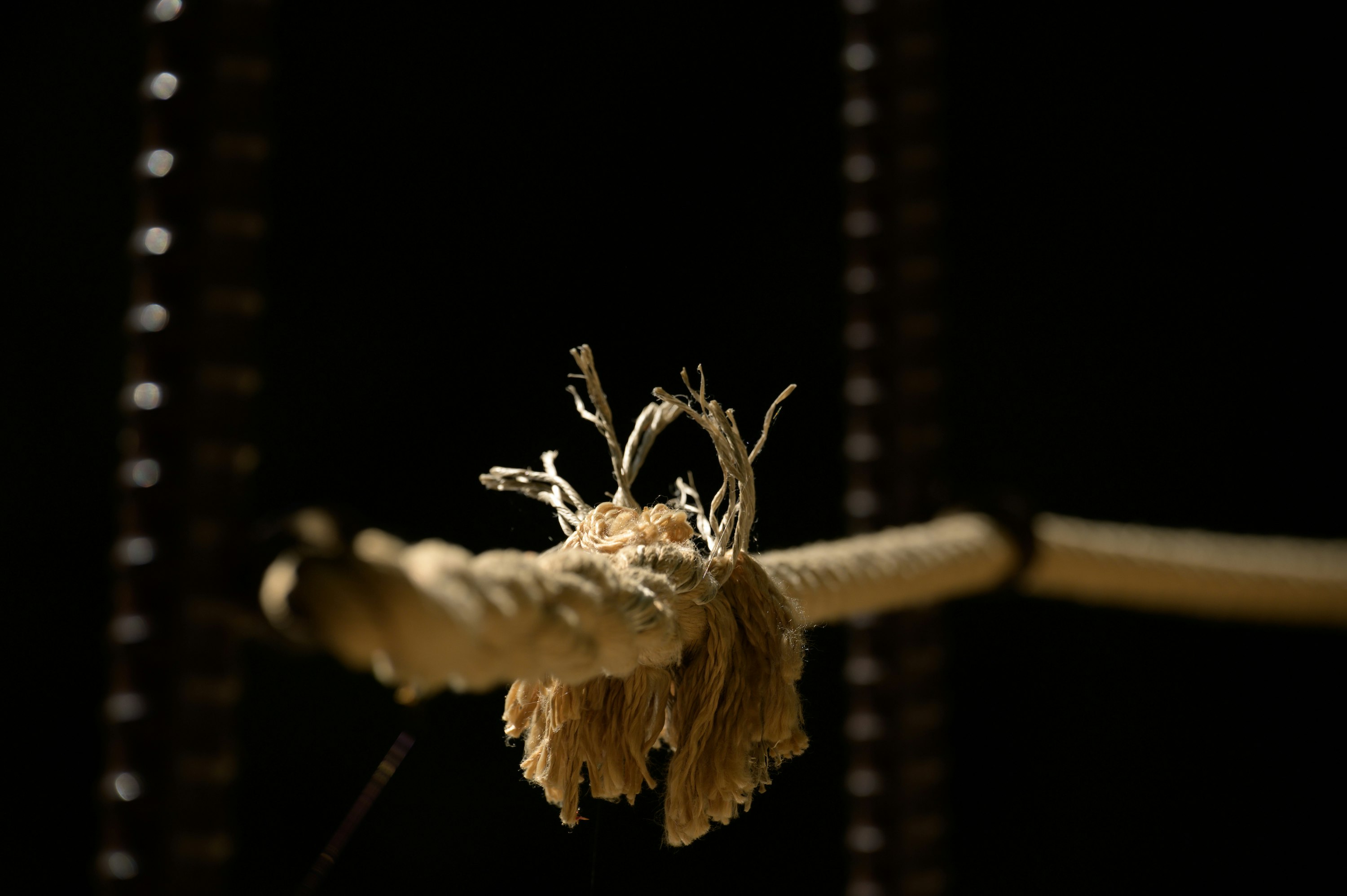 white rope tied on brown wooden pole